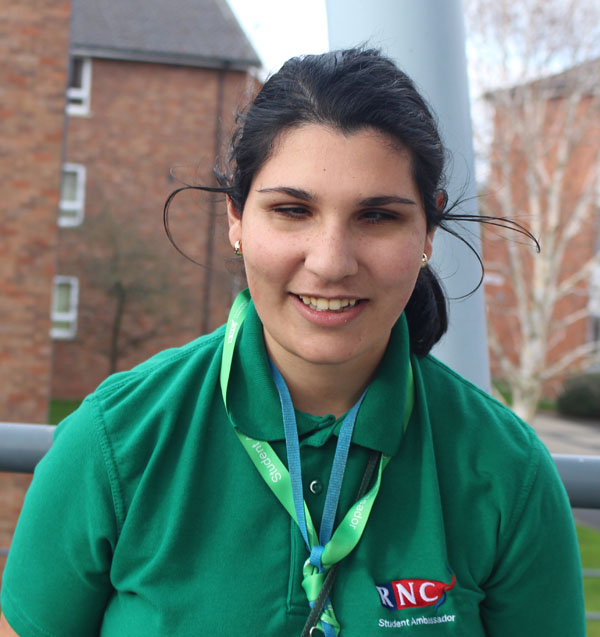 A portrait of Hazal wearing her green student ambassador top