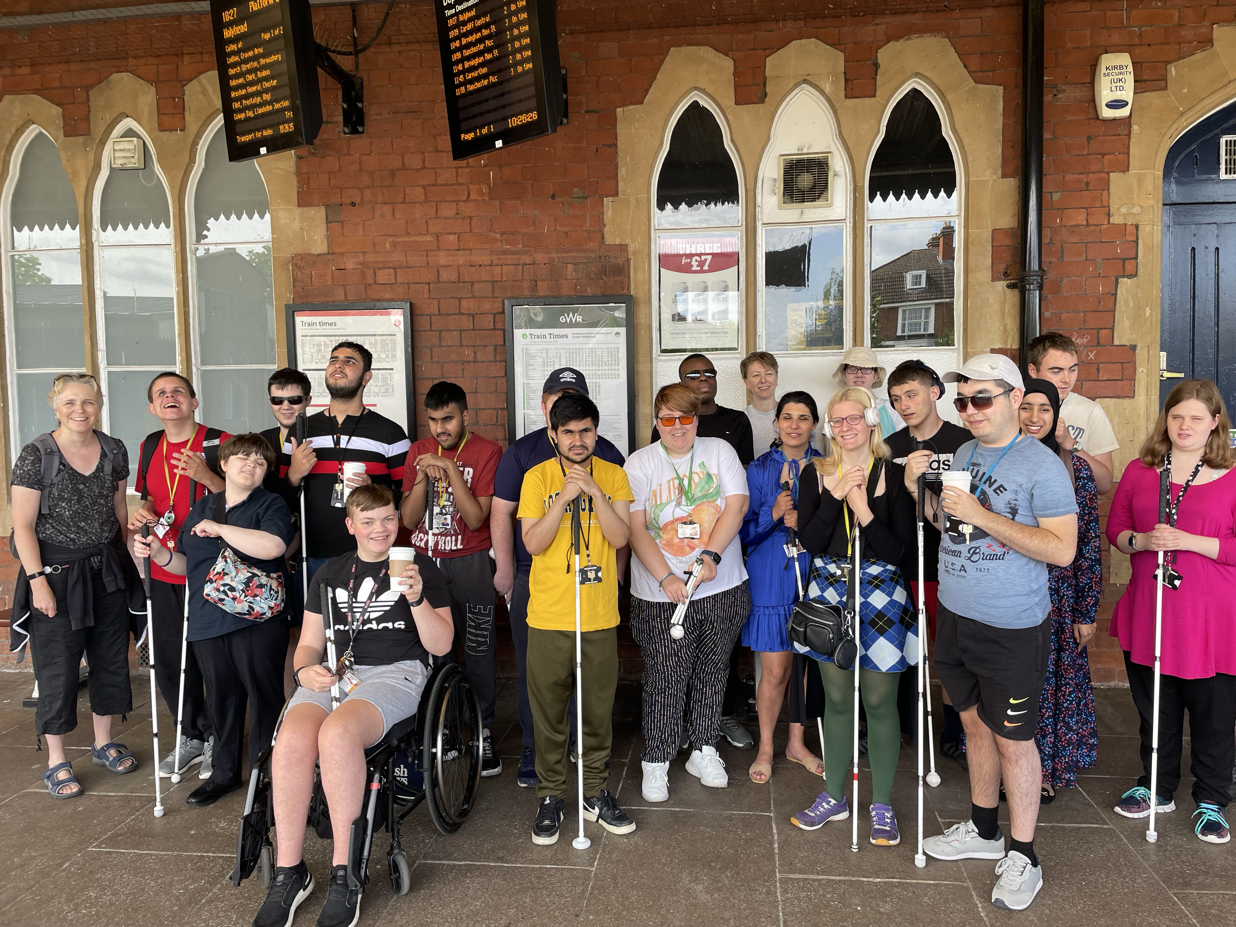 The group of staff and students standing outside Hereford Railway Station