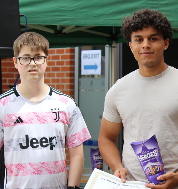 Zach and Tait collecting their award