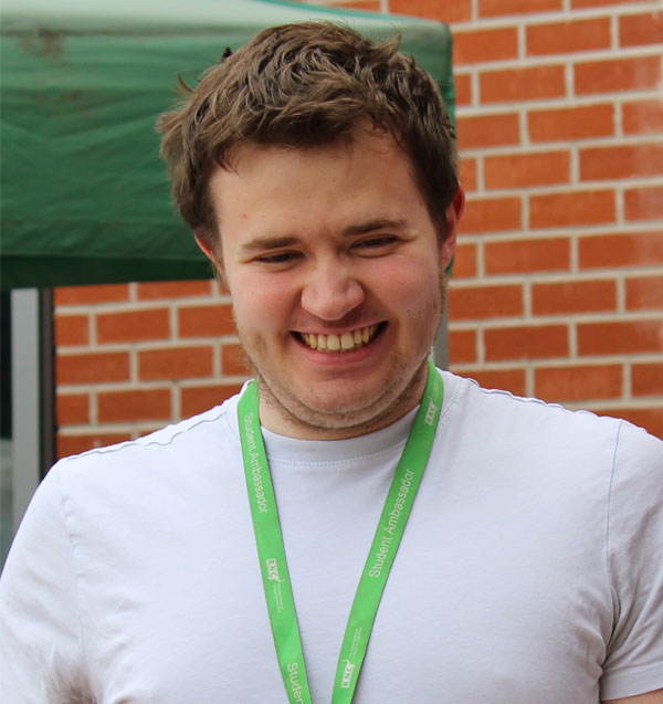 A headshot of Fionn smiling