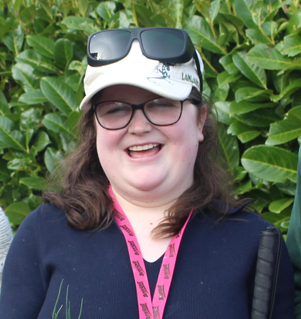 A head and shoulders picture of Katie smiling