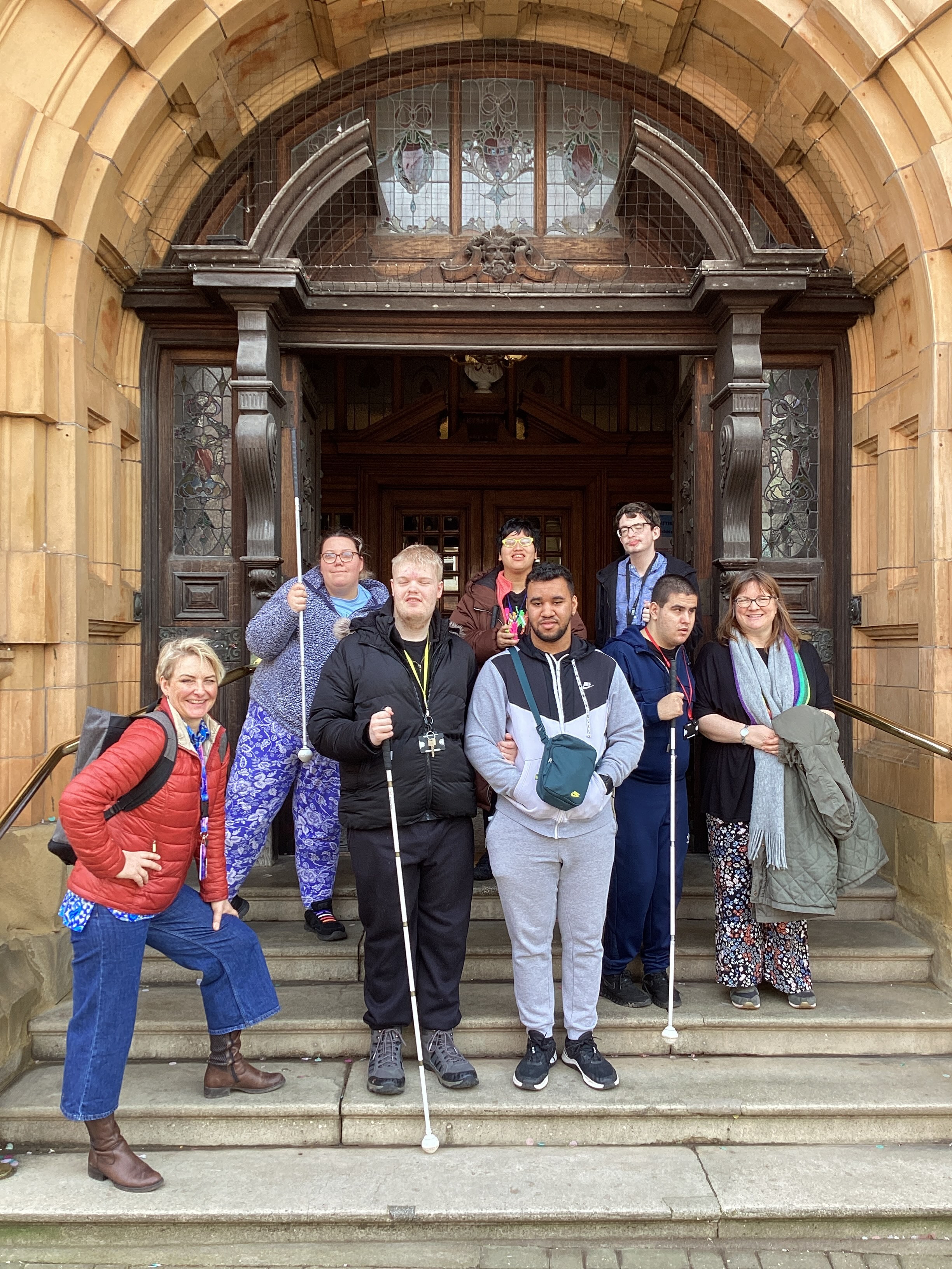 The class and their teachers standing on the grand town hall steps