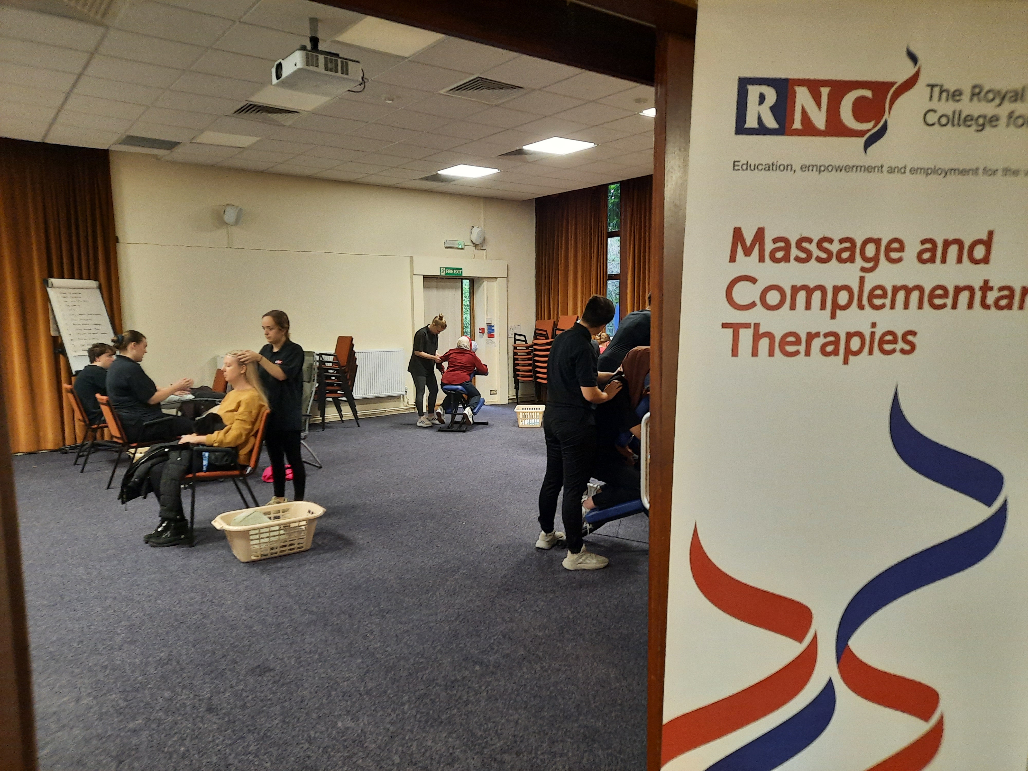 massage students massaging clients