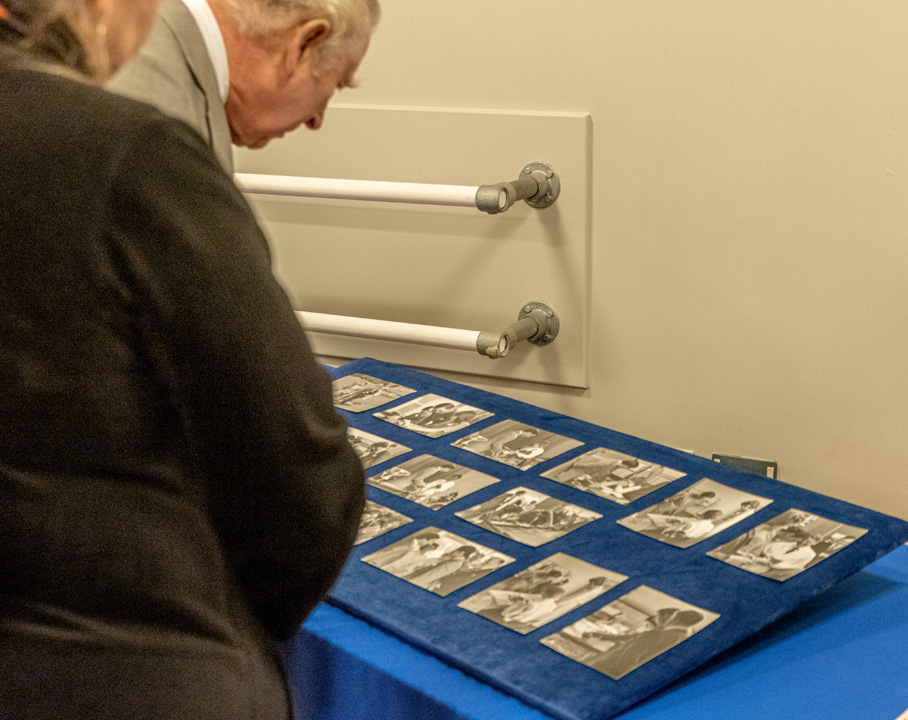 The King looking at the display of old photos