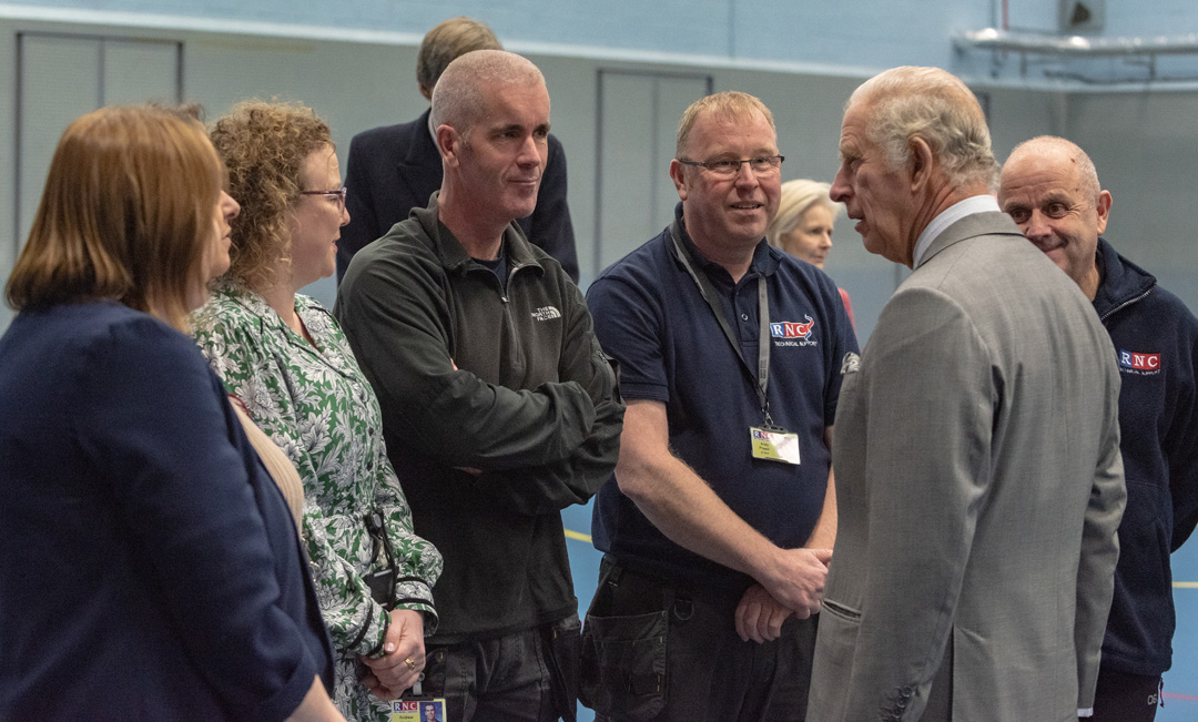 The King talking to the long serving business support staff